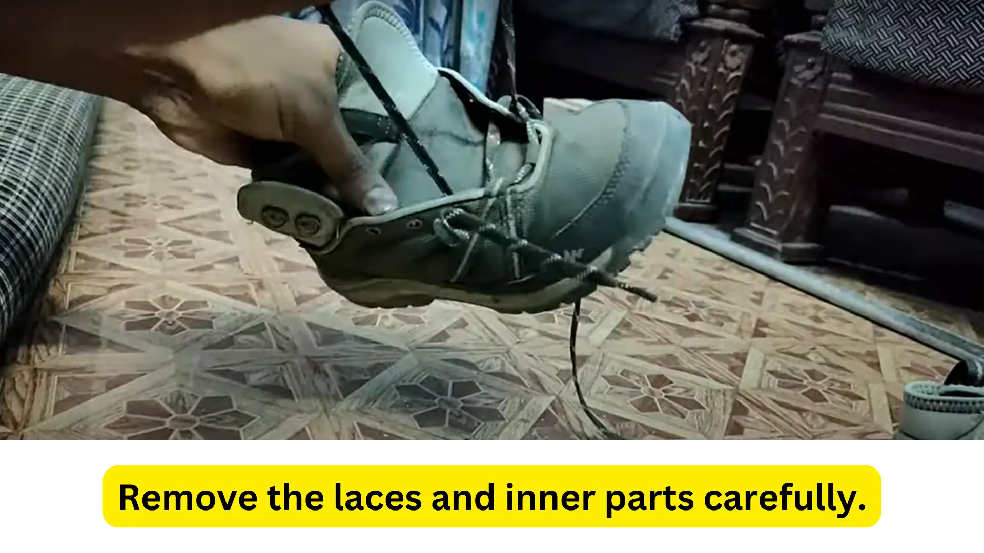 removing the laces and inner parts from a hiking boot image
