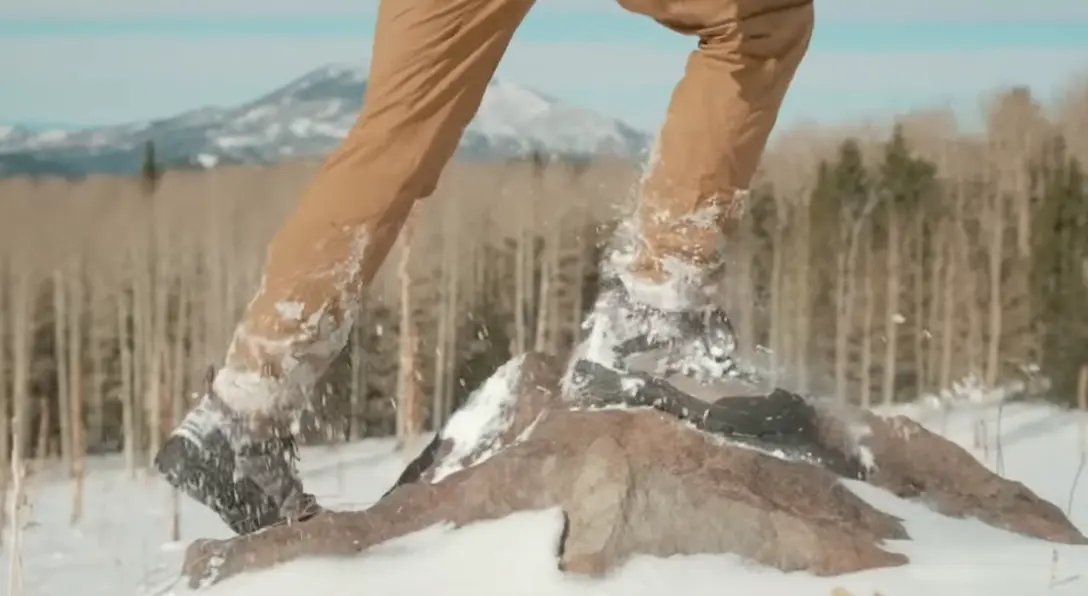 Hiking boots walk on snow